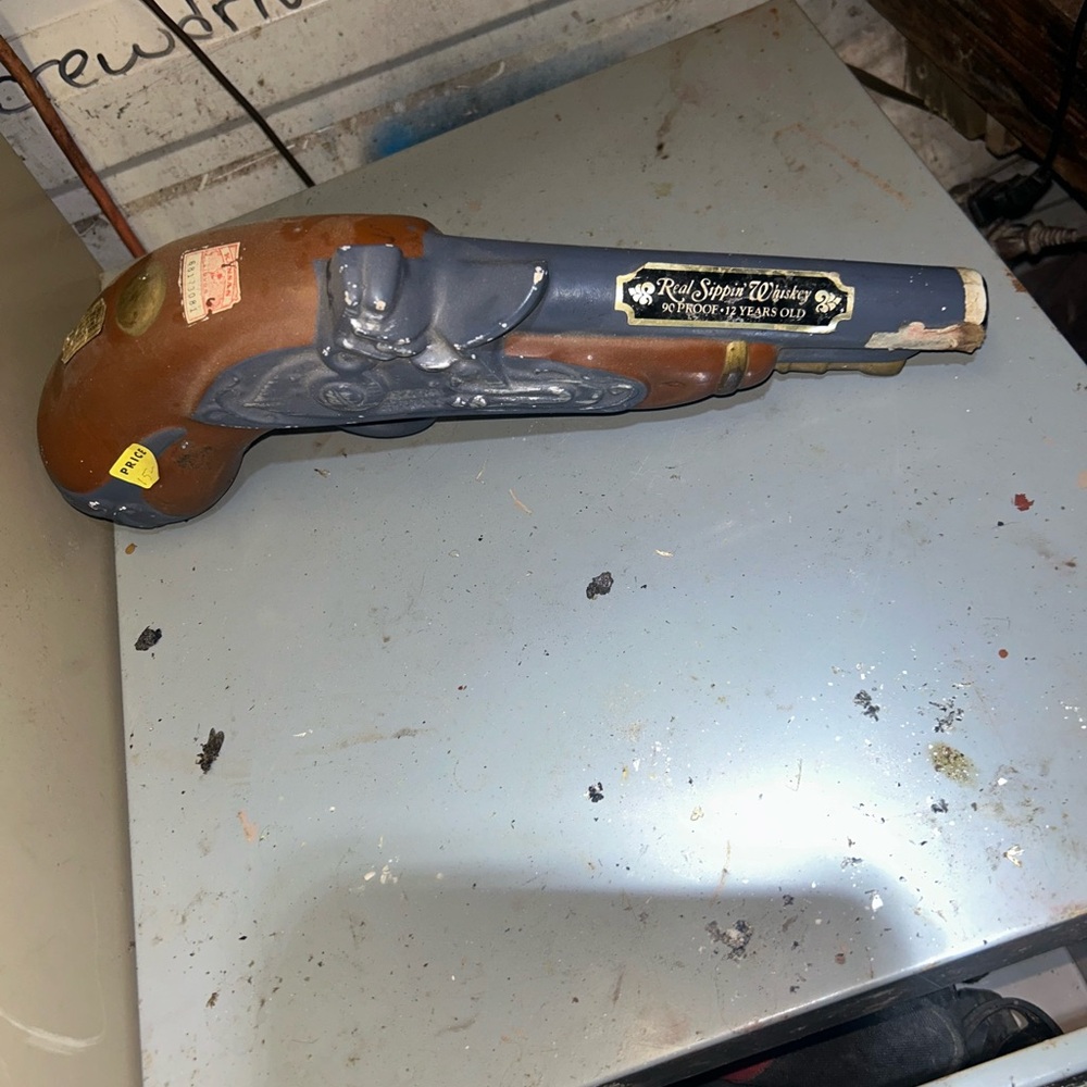 Vintage  gun liquor bottle.
